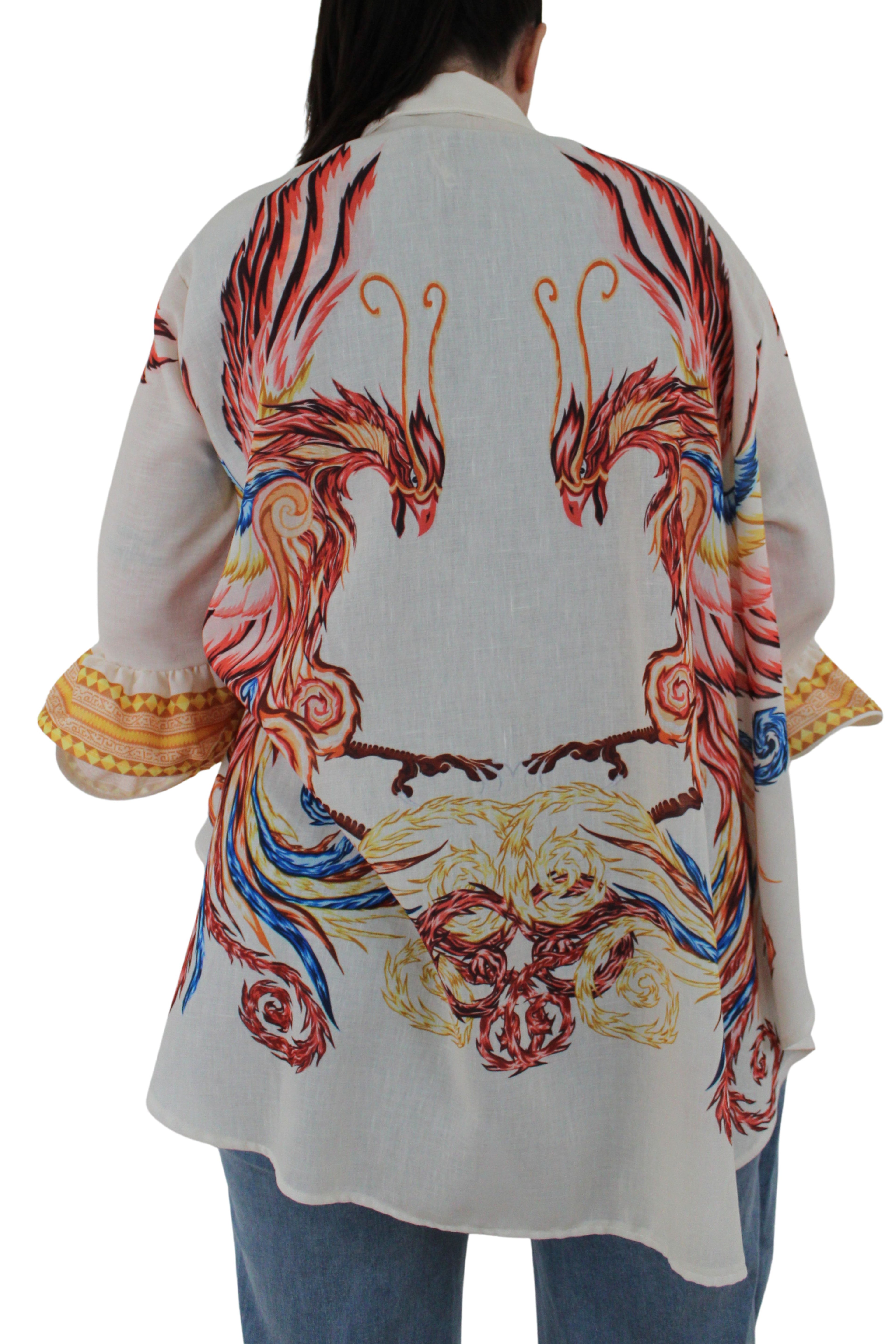 camisa de jot_milano con volantes en las mangas y dibujo pintado de ave fenix fabricada en italia