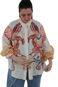 camisa de jot_milano con volantes en las mangas y dibujo pintado de ave fenix fabricada en italia