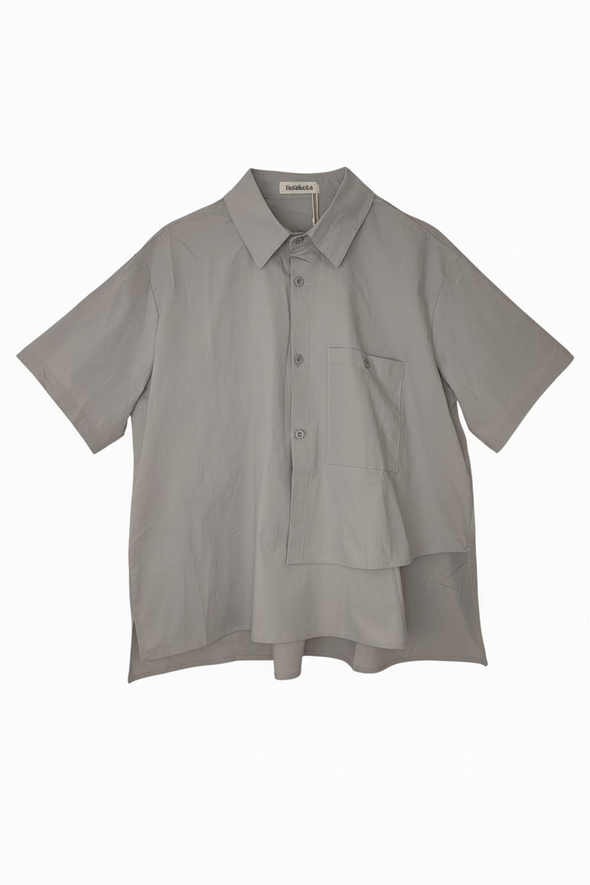 camisa de nefelibata en gris asimetrica con bolsillo delantero