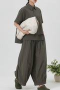 conjunto de nefelibata en verde con camisa asimetrica y pantalon globo
