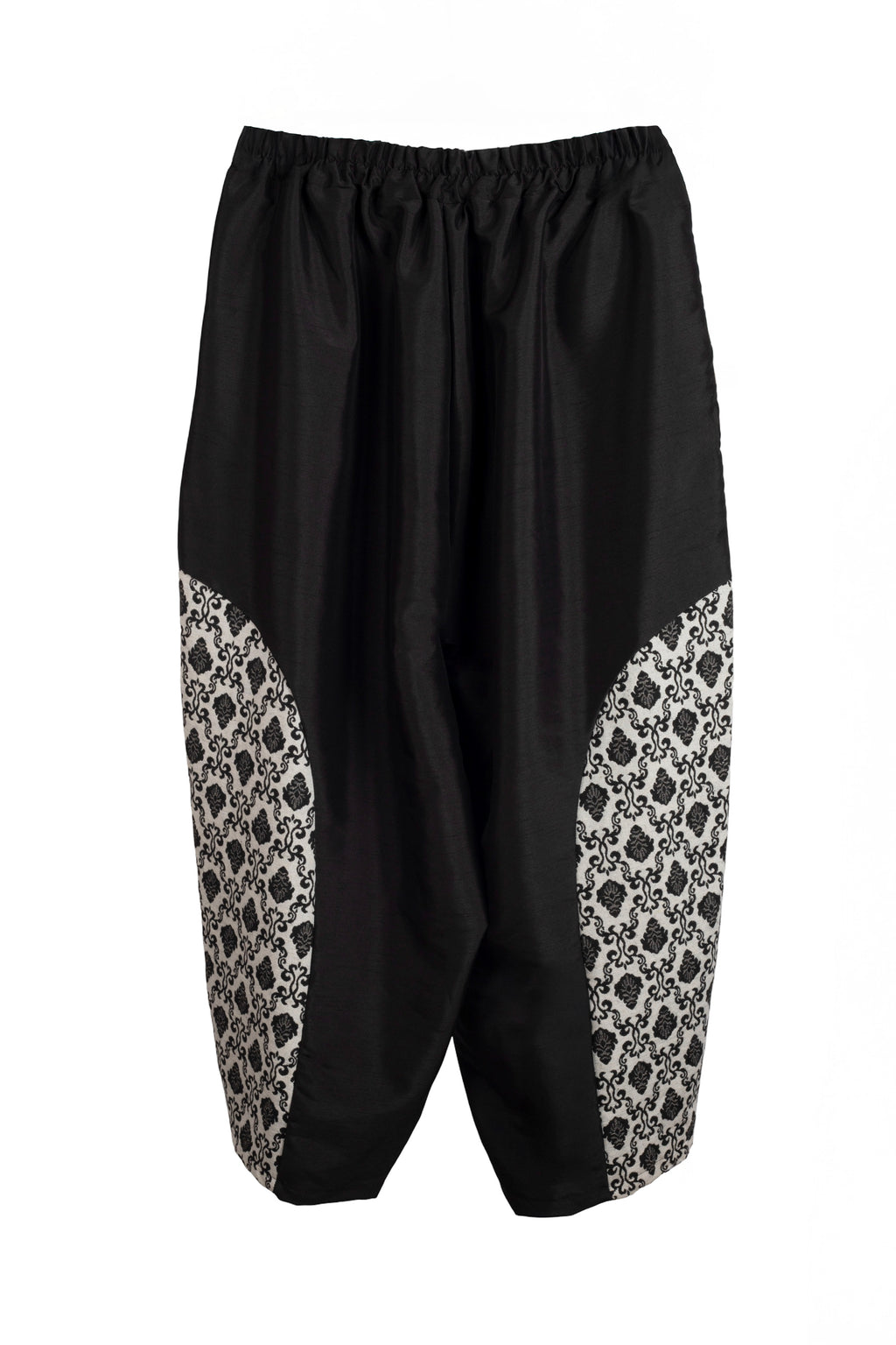 Pantalón globo con encajes laterales en tonos beige y dos bolsillos delanteros LYKKE