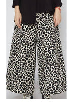 pantalon wendy trendy en micro pana y estampado vaca tipo globo