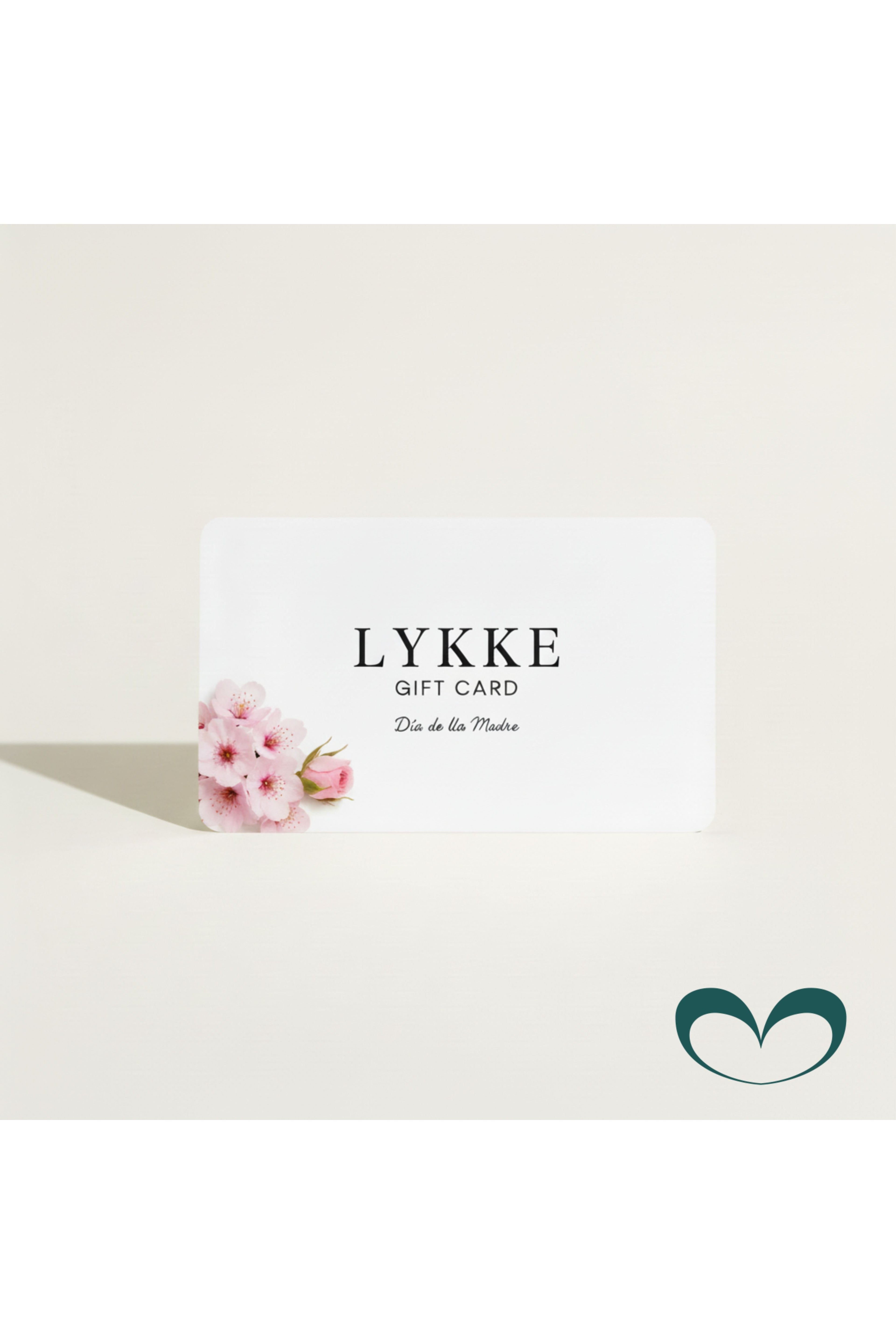 Tarjeta regalo LYKKE con flores naturales y texturas orgánicas en tonos beige y crema, mensaje "Disfruta de este momento. Gracias por ser parte de LYKKE" y logo de la marca